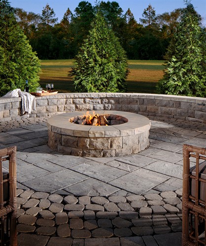 Relax and unwind around a beautiful paver fire pit.