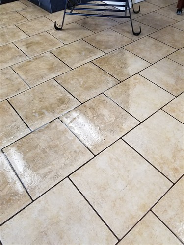 tile and grout floor being cleaned