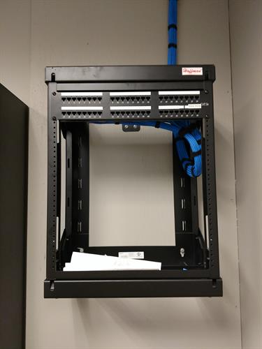 Here we did the cabling and installed a wall mounted rack