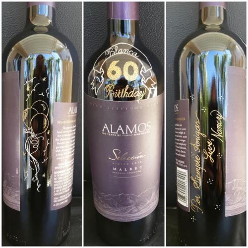 This Birthday bottle was hand engraved with a dedication and a balloon drawing. The number 60 was stippled hand engraved to give it a special effect.