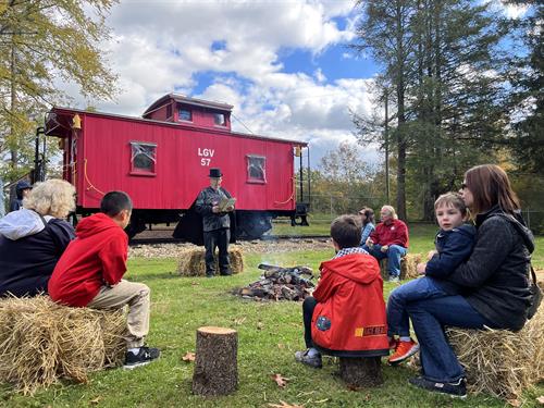Campfire storyteller Ed Kelemen shares spooky stories with guests attending the annual "Creepy Caboose" event at the Ligonier Valley Rail Road Museum. 