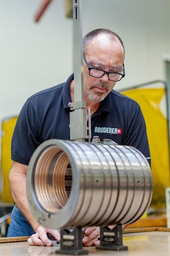 Kevin Bozarth inspecting parts.