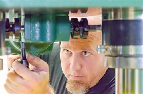 Mike Avra working on a press.