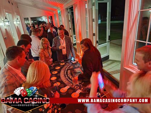 BAMA Casino Company Tables for Events with Casino Decor and uplighting