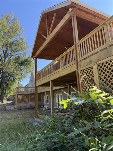 One side of the wrap around deck we recently completed.  Gotta love covered outdoor spaces.