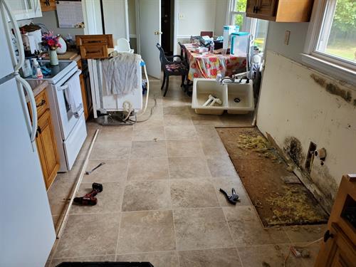 A dish washer leak caused water damage and mold in this Toney kitchen.