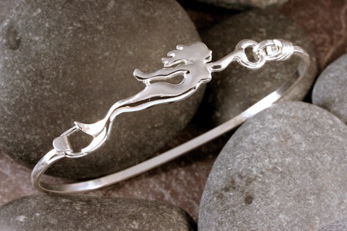 A sterling silver mermaid silhouette bracelet