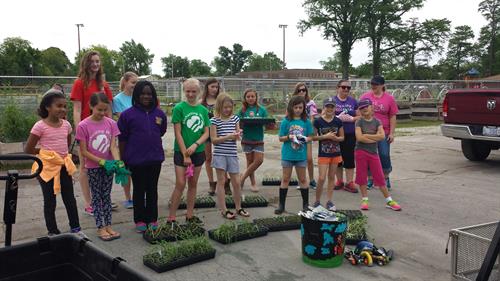 Girl Scouts planting at the garden