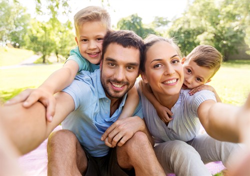 Gallery Image Family_Having_Picnic_and_Taking_Selfie_at_Park(2).jpg