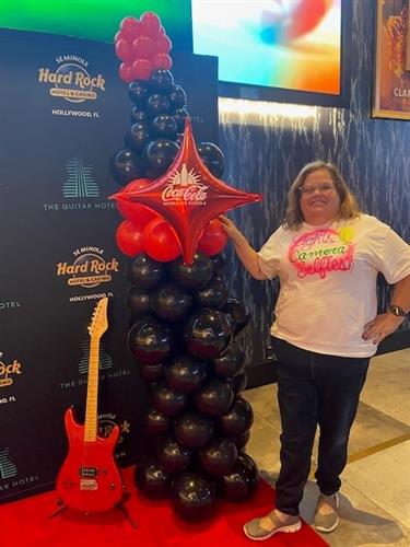 Celebrating Coke!  A balloon sculpture of a coke bottle.