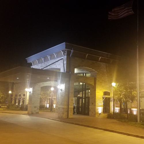 The nighttime exterior of Plaza Theatre Company at Dudley Hall