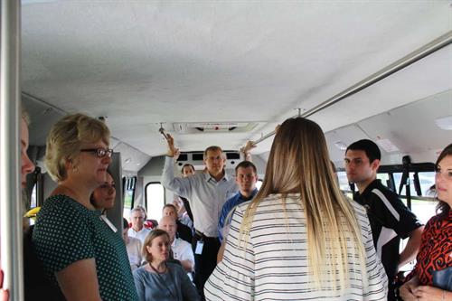 Visit our campus for a KNOW Poverty tour and see how we are helping our clients walk out of poverty for good!  (photo - tour group in one of our Transportation buses).