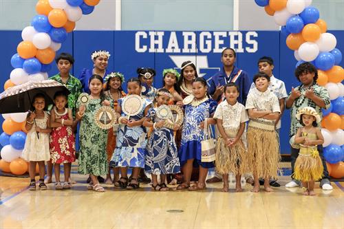 children adorn with Marshallese handicrafts