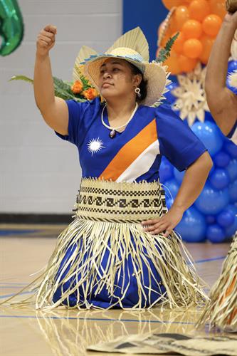 Director Bethany of Culture and Historical Preservation Office performing a Marshallese dance
