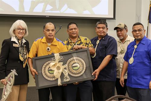 Chief Farrend presenting gift to Rep. Helen Kerwin