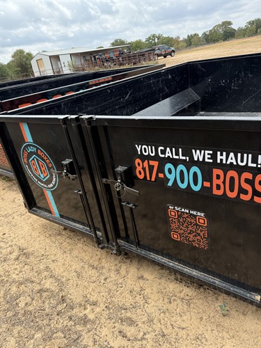 Boss Lady Boxes dumpster with barn-style rear doors that open wide for easy walk-in loading of furniture, bulky items and cleanup debris.