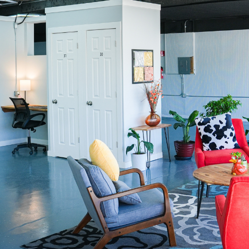 Front lobby meeting space with a workspace