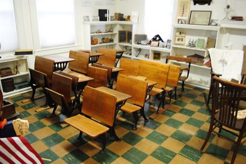 Desks lined up in our One Room School exhibit.