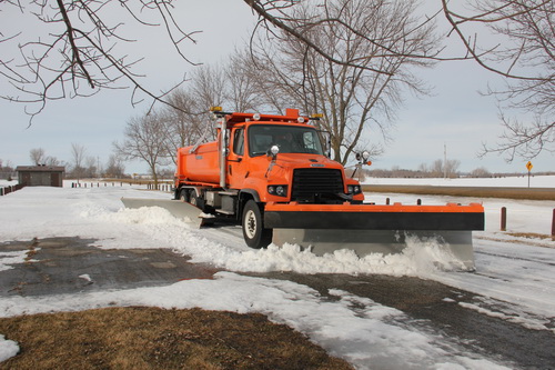Truck plowing snow.