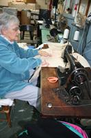Seamstress Jean Henderson making cider press cloths at OESCO