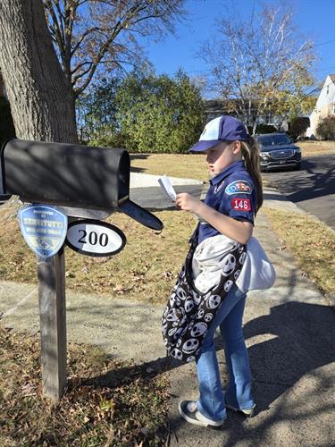 Giving back to our community! Pack 146 Scouts are distributing flyers for our Scouting for Food drive to help fight hunger.