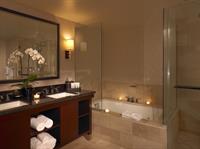 The Dana Point Suite bathroom features marble counter tops, luxurious linens and upscale amenities.