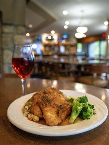 Garlic Chicken with Fried Rice — Featured Special at LedgeStone Grille  Savory garlic-seasoned chicken served with perfectly prepared fried rice, this flavorful special showcases the comfort and quality you can expect at LedgeStone Grille. Enjoy rotating chef-inspired specials like this one, paired perfectly with your favorite beverage in our welcoming, open-to-the-public dining room near Table Rock Lake.