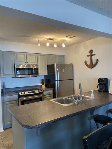 Everything you need to cook your meals at Unit 533.  Beautiful stainless appliances and cooktop stove. 