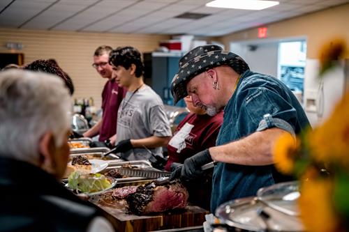 Chef Jeff serves delicious foods with his College of the Ozarks students.