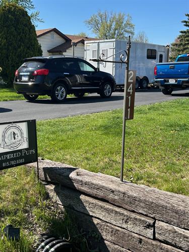 Street View of grooming trailer with address sign