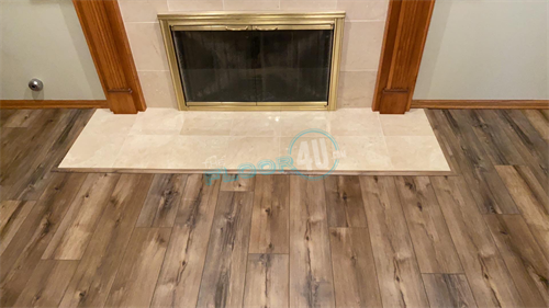 LVP around a fireplace with tile