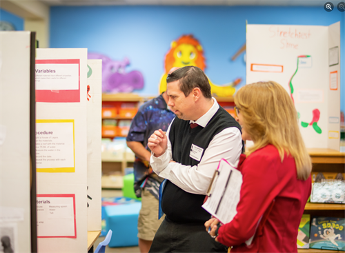 Our Assistant Branch Manager, Tim Reed, volunteering as science fair judge at Blue Bonnet Elementary.