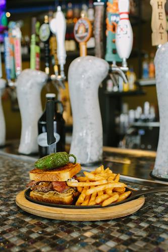 Our beers are served from taps encased in ice at 34'. Beer goes great with a Jalapeño Cream Cheese Burger!