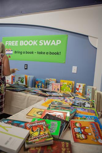  Fun With Fiction’s free book swap tables—where kids can pick out a book to take home and donate books they’ve outgrown, creating a fun cycle of sharing and discovery! 