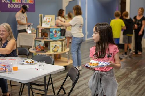 Snacks, crafts, and books—oh my! ??? This young reader is enjoying all the fun at our latest Fun With Fiction event.