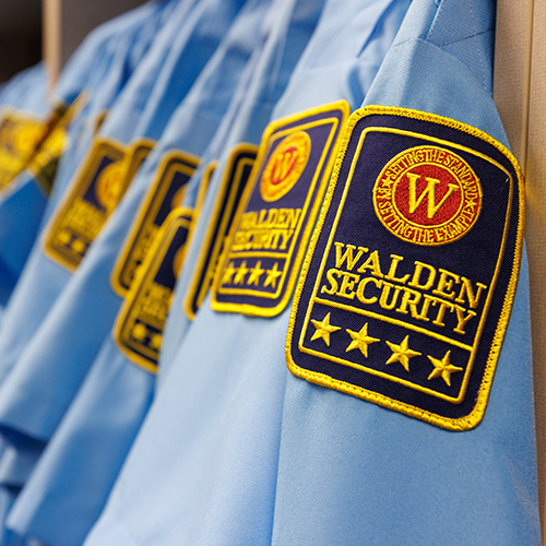 Walden Security Uniform Room showing a row of uniforms