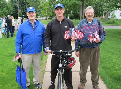 Handing out free flags at the Memorial Day Parade