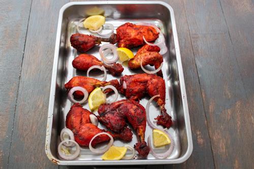 Tandoori chicken ( Bone in chicken cooked in clay oven)