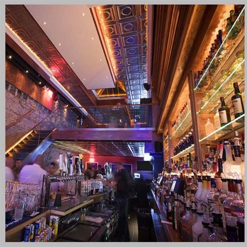 Hospitality interior design project in New York City featuring a dynamic bar and entertainment space.