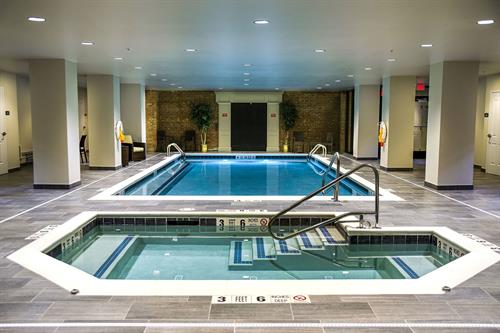 Amenities incude a communal indoor pool and whirlpool spa