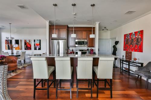 Kitchens boast granite countertops, stainless steel appliances, and Kohler fixtures