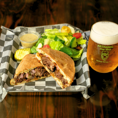 Bourbon short rib panini at Artisanal Brew Works, a Saratoga Springs restaurant offering elevated bistro-style food and a full menu