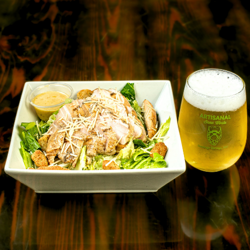Souv Vide Chicken Caesar salad and craft beer at Artisanal Brew Works, a Saratoga Springs restaurant with a full food menu