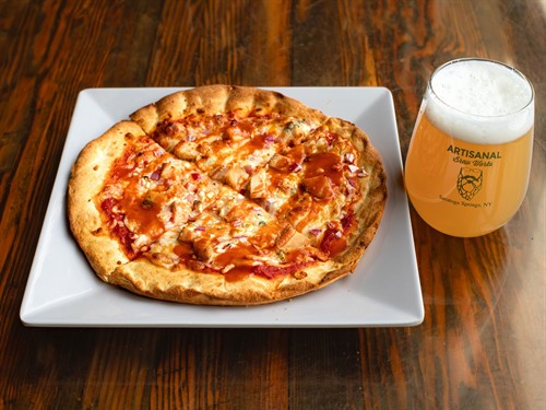 Buffalo chicken pizza with tender chicken, blue cheese, and a bold hot sauce drizzle, served at Artisanal Brew Works in Saratoga Springs. A flavorful, crowd-pleasing option at Nature’s Edge Bistro.