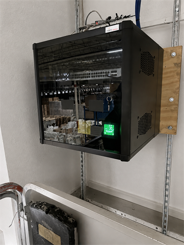 Wall-mounted network infrastructure installed and configured for a commercial facility.