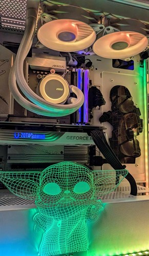 Inside a custom white build: all-in-one liquid cooler, graphics card, and personalized lighted accents, assembled in-house.