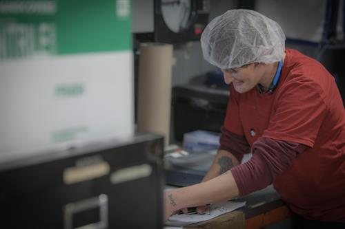 An associate hard at work in manufacturing at Rhino Foods.