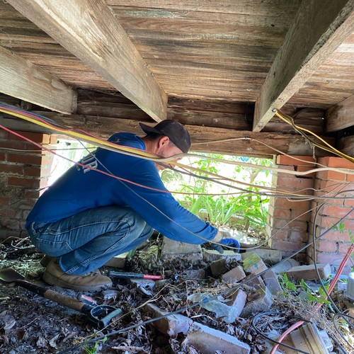 Crawling under homes is hard work