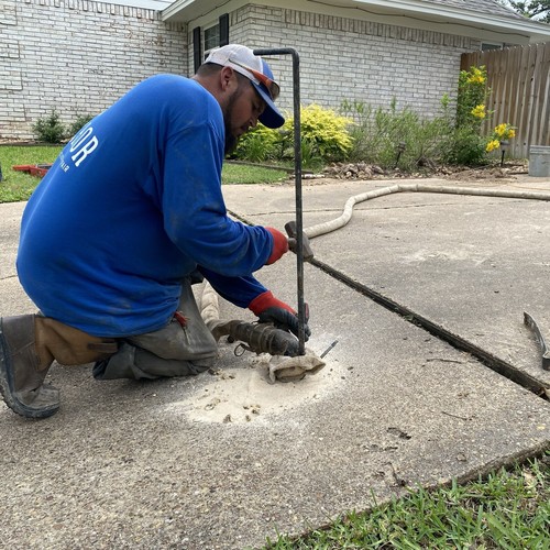 Pumping slurry to raise and level concrete