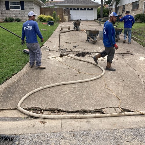 Mud jacking to level a driveway